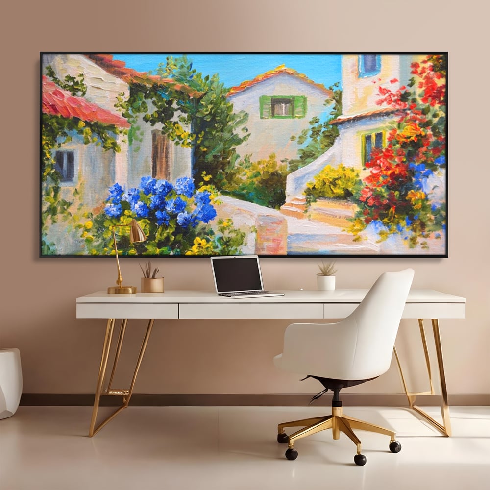 Tablou canvas cu pictura peisaj mediteranean cu case, in rama de aluminiu negru, pe perete intr-un birou